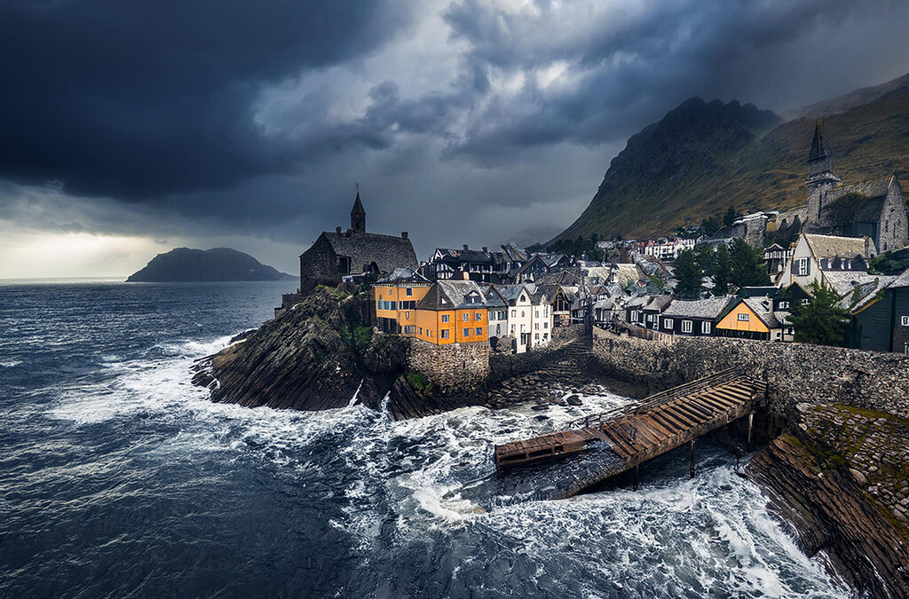 Stormy sky over the coastal city of Aelthorn, with rugged cliffs, ancient buildings, and churning sea waves.